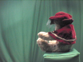 90 Degrees _ Picture 9 _ Teddy Bear Wearing Red Cape.png